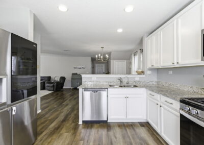 open kitchen with granite countertops at 7342 Storms End in Far West San Antonio