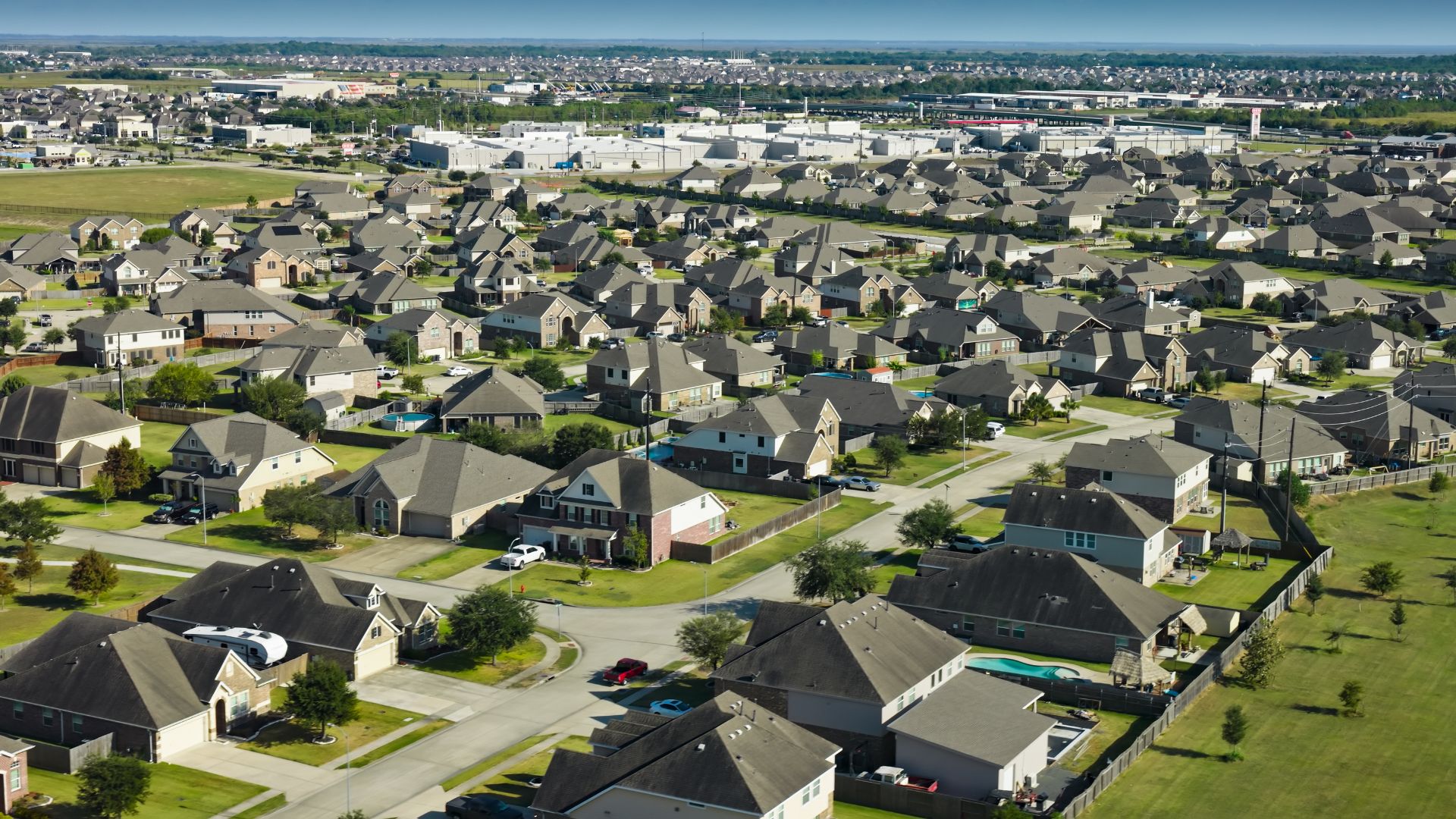Aerial view of a suburban neighborhood near JBSA Lackland in San Antonio, Texas showing single-family homes and residential streets